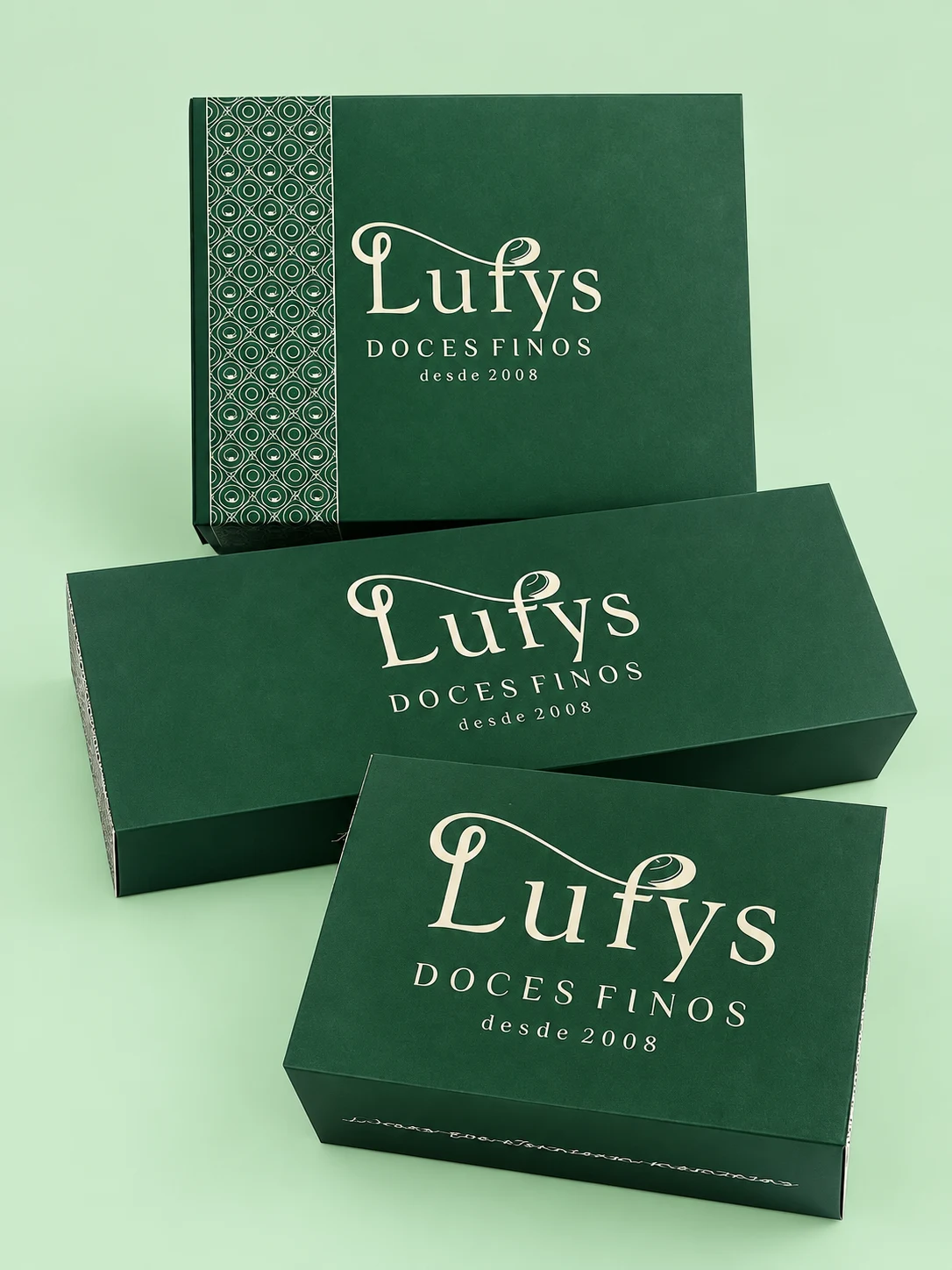 Conjunto de três embalagens verdes personalizadas da Lufys Doces Finos.